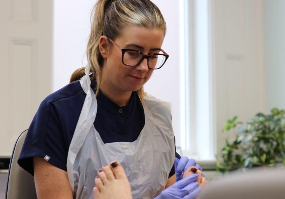 Kirsty, podiatrist at LR Podiatry, Sheffield treating a patient